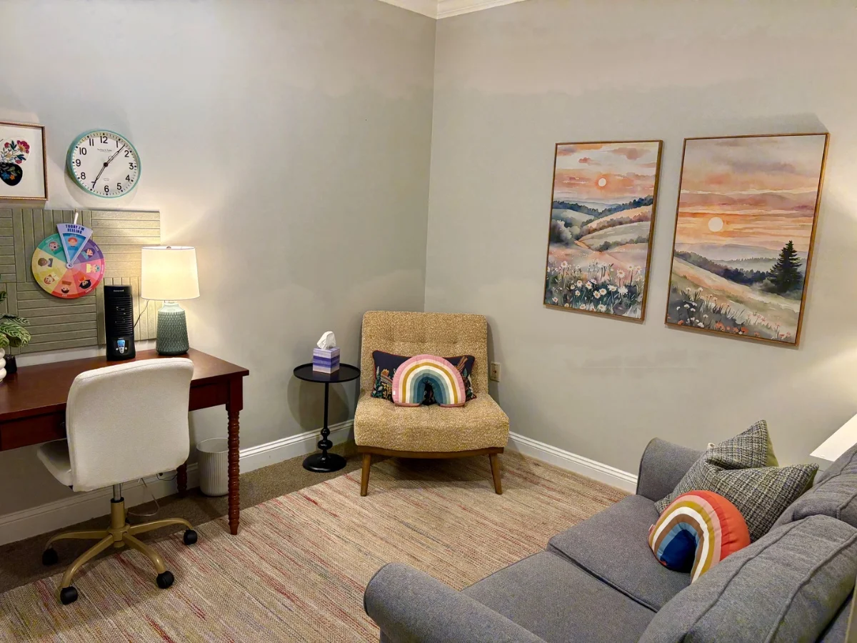 Spacious middle therapy office suite with desk and seating